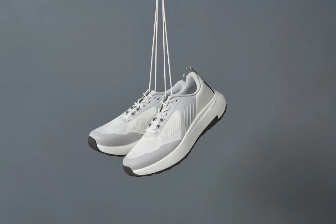 A pair of BR-001 Off White hanging by the laces