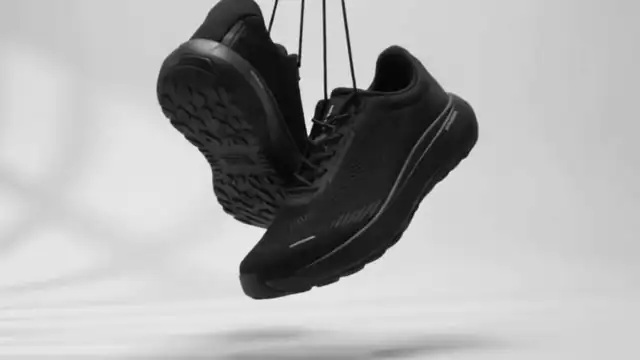 DARIMATI VT-001 Core Black pair hanging, showing the outsole and knit upper